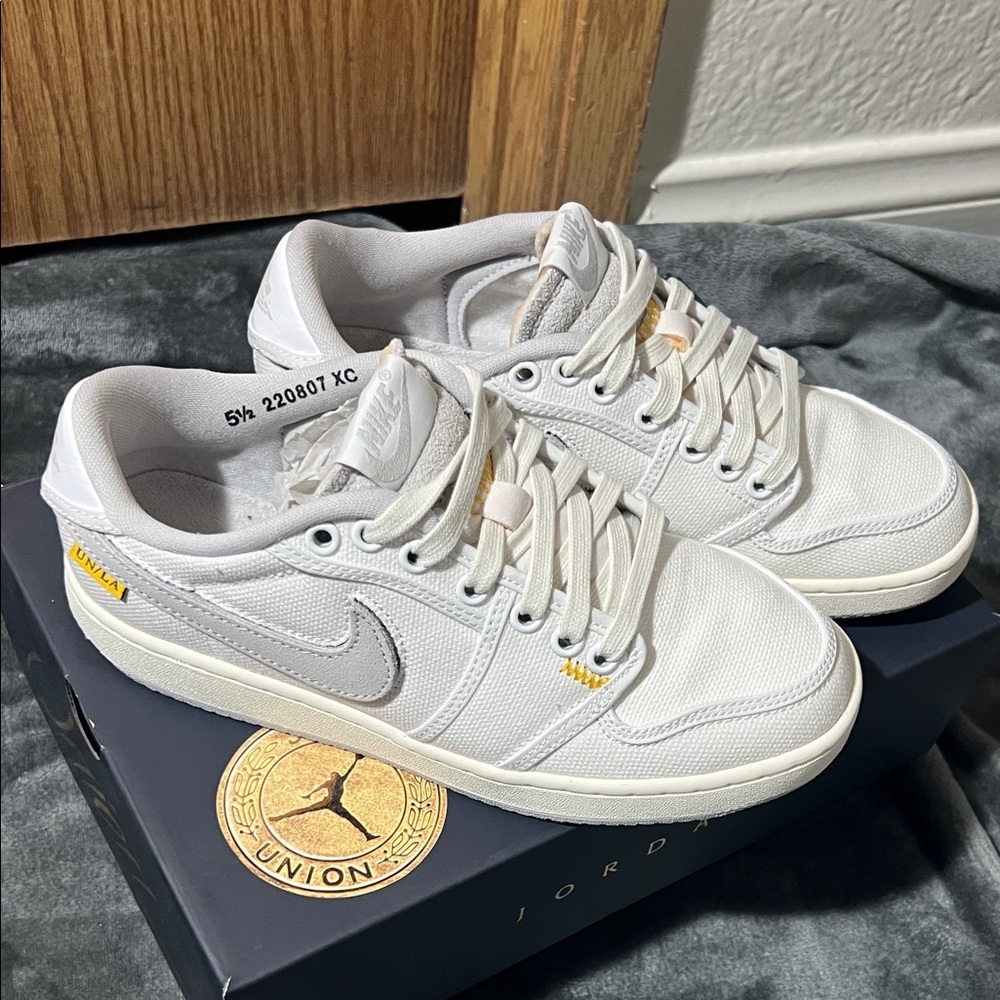 Nike Air Jordan Low in White and Gold Accents